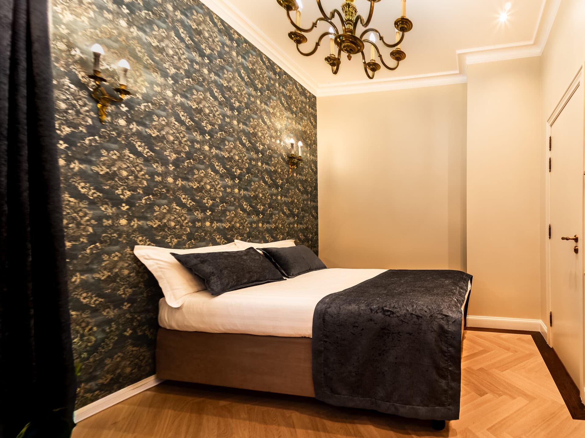 Standard Double Room with ornate floral wallpaper and queen bed