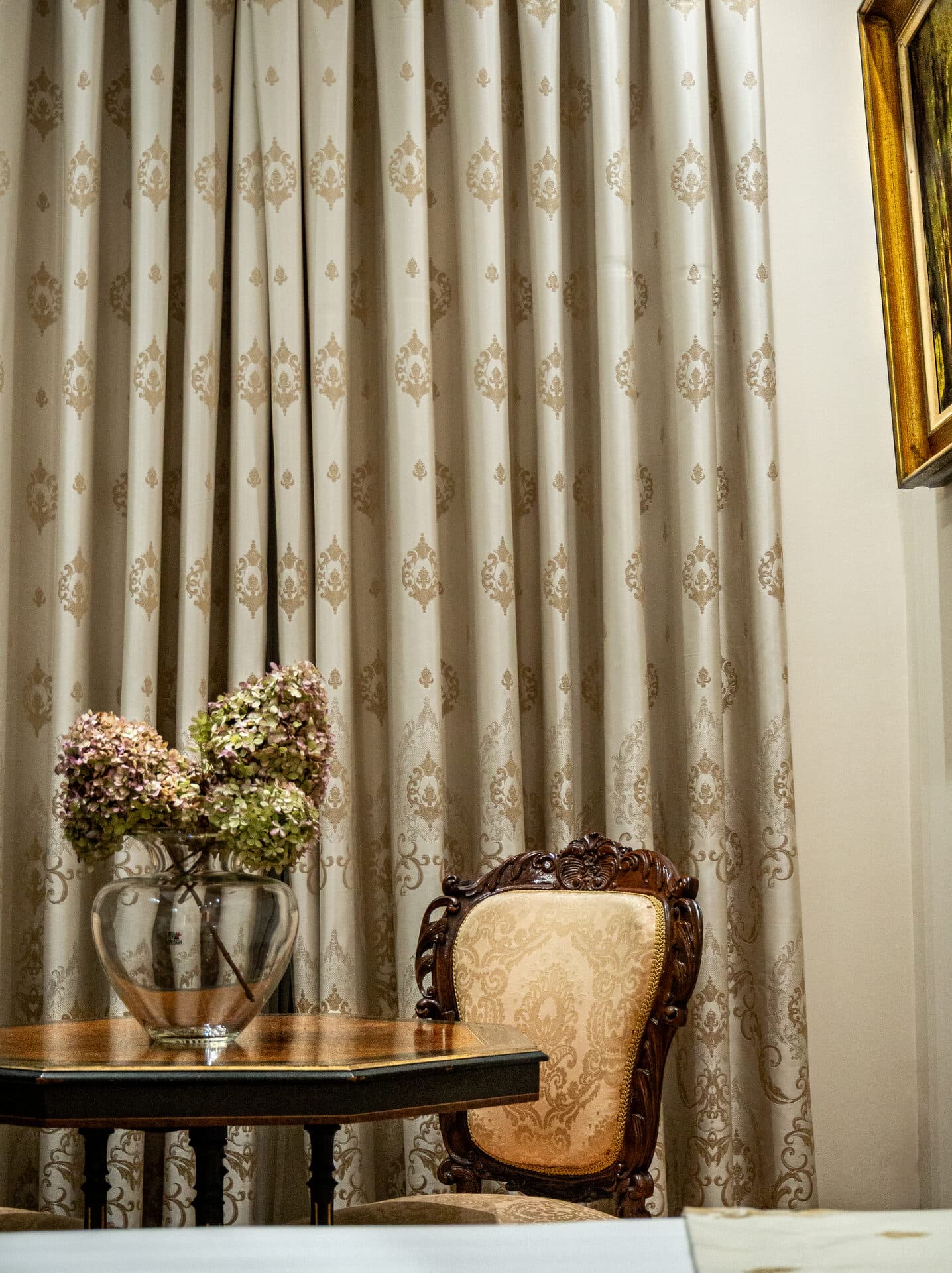Elegant curtains and period furniture in the Superior Twin Room